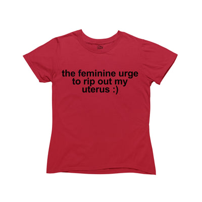 Red baby tee with white text that reads “the feminine urge to rip out my uterus“