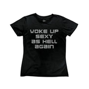 Black baby tee with bold bedazzled inspired white text that reads 'woke up sexy as hell again’