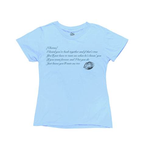 Baby blue baby tee featuring a design inspired by Sabrina Carpenter's album 'Short and Sweet.' The shirt showcases lyrics from the chorus of her song 'Taste' printed in a stylish, bold font across the front